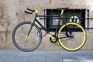 Fototapeta na wymiar Cool black and yellow bike locked