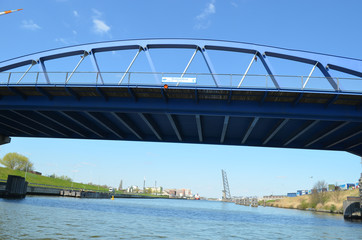 blue iron bridge over canal