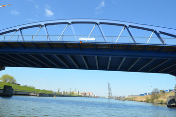 blue iron bridge over canal