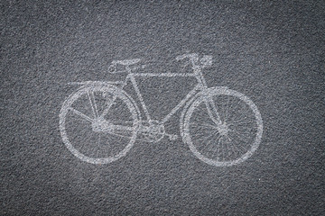 Fototapeta na wymiar Bicycle sign on bicycle lane in asphalt road
