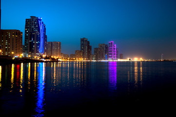 Fototapeta premium Sharjah downtown night scene with city lights, luxury new high