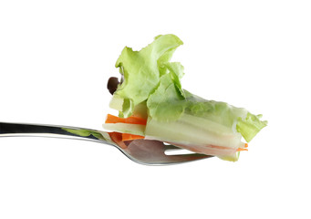roll salad on fork isolated on white.