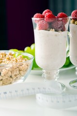 Glass of dessert with yoghurt, fresh berries and muesli