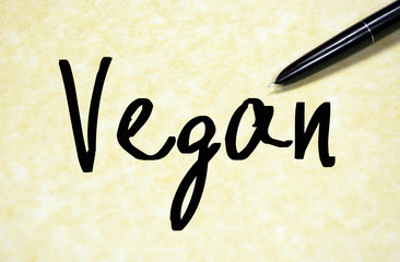 vegan word write on paper