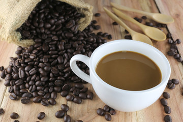White coffee cup and roasted coffee beans.