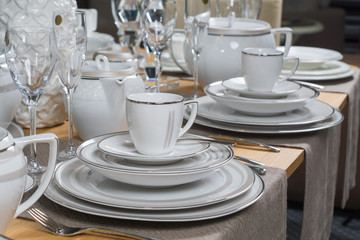 white luxury ceramic dinner service on wooden table 2