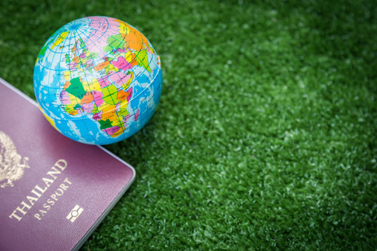 Photo of passport, money and world map.