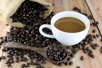 White coffee cup and roasted coffee beans.