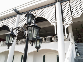  street lamps in front of white classic building style