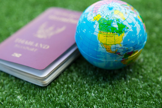 Photo of passport, money and world map.