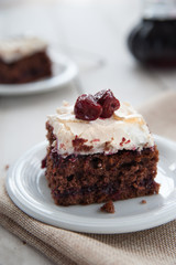 Piece of cherry and meringue cake