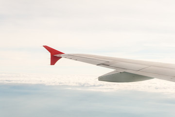 Obraz premium view from the plane on the wing and clouds