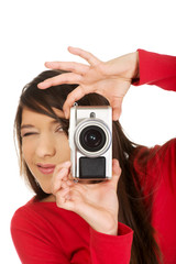 Woman taking a photo with camera.
