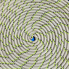 The rope wrapped in a spiral on sailboat yacht detail.