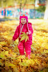 Little girl walking in the park