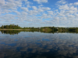 Clouds in the sky. Lake view from Lapland, Finland.