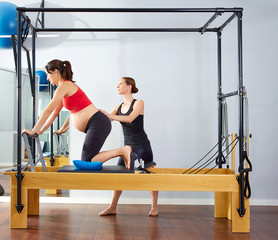 pregnant woman pilates reformer cadillac exercise