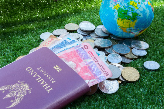 Photo of passport, money and world map.