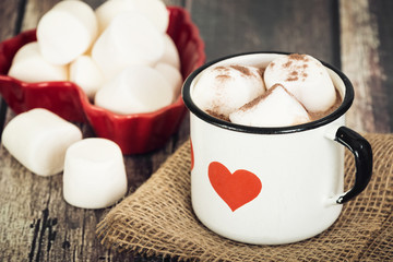 Obraz na płótnie Canvas Hot Chocolate and marshmallows in vintage enamel cup