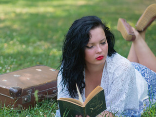sexy naughty girl elbow in the green grass