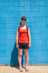 Teen girl on blue wall background