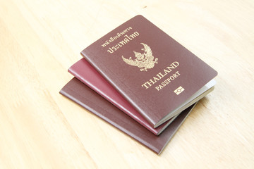Thailand passports on wooden background