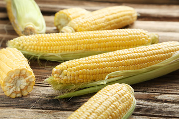 Corns on a brown wooden background