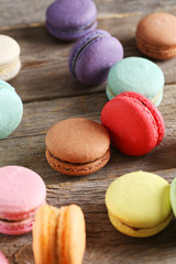 French colorful and tasty macarons on grey wooden table
