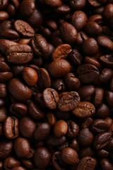 Roasted coffee beans background, close up