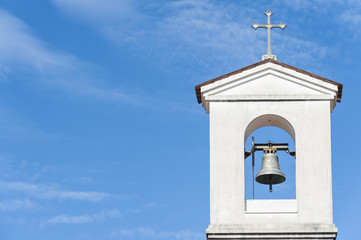 Small bell tower with a bell of a country church  - Powered by Adobe