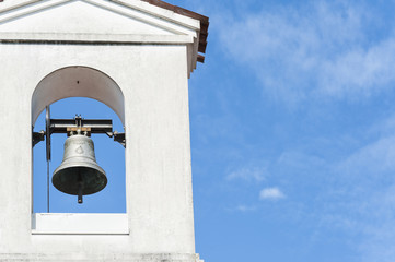 Small bell tower with a bell of a country church 