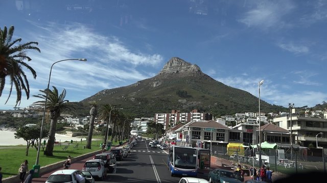 Driving through Camps Bay (Cape Town, South Africa) at a sunny day (4K timelapse footage)