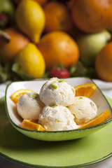 Vanilla ice cream with tropical fruits.
