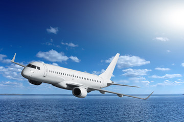 passenger airplane flying over sea
