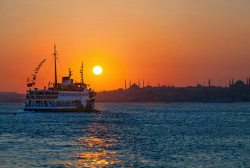 Fototapeta premium Passenger Ferry in the Bosphorus at sunset, Istanbul, Turkey