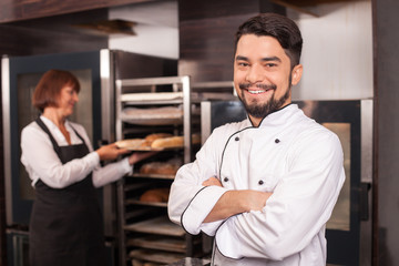 Fototapeta premium Cheerful chefs are in process of work