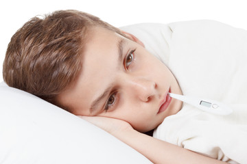 Boy with the thermometer preparing for treatment procedures