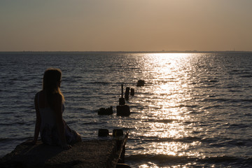 girl looking at the sunset