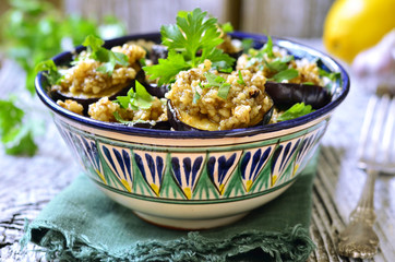 Fried eggplants slices with walnut and garlic sauce.