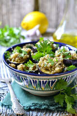 Fried eggplants slices with walnut and garlic sauce.