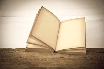 Stock Photo:.old book open blank pages, empty yellow paper on da