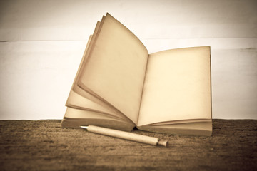 Stock Photo:.old book open blank pages, empty yellow paper on da