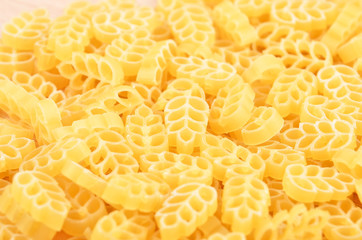 Close up of wheat shaped pasta as background, DOF