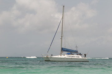 White catamaran on azure water against blue sky, Caribbean Islands