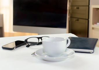 Coffee cup on the desk