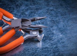 Composition of insulated electric pliers nippers on scratched me