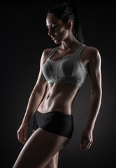 Fototapeta na wymiar attractive fitness woman, trained female body, lifestyle portrai