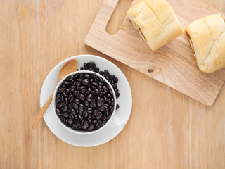 Fresh black coffee in a white cup of coffee with bread cut