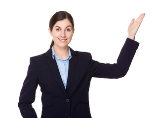 Brunette young businesswoman with open hand palm