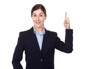 Young businesswoman with finger point up